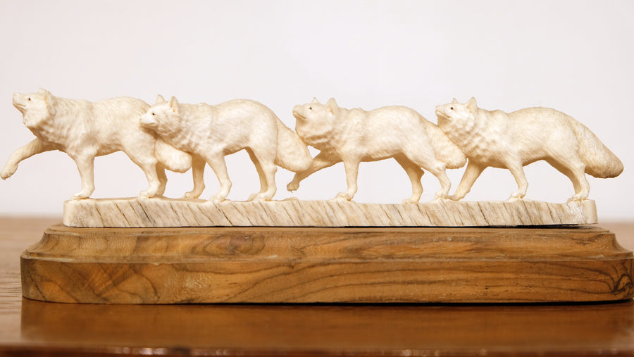 WOLF PACK CARVED OF BONE