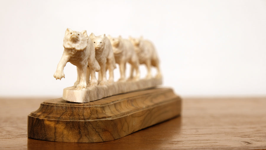 WOLF PACK CARVED OF BONE